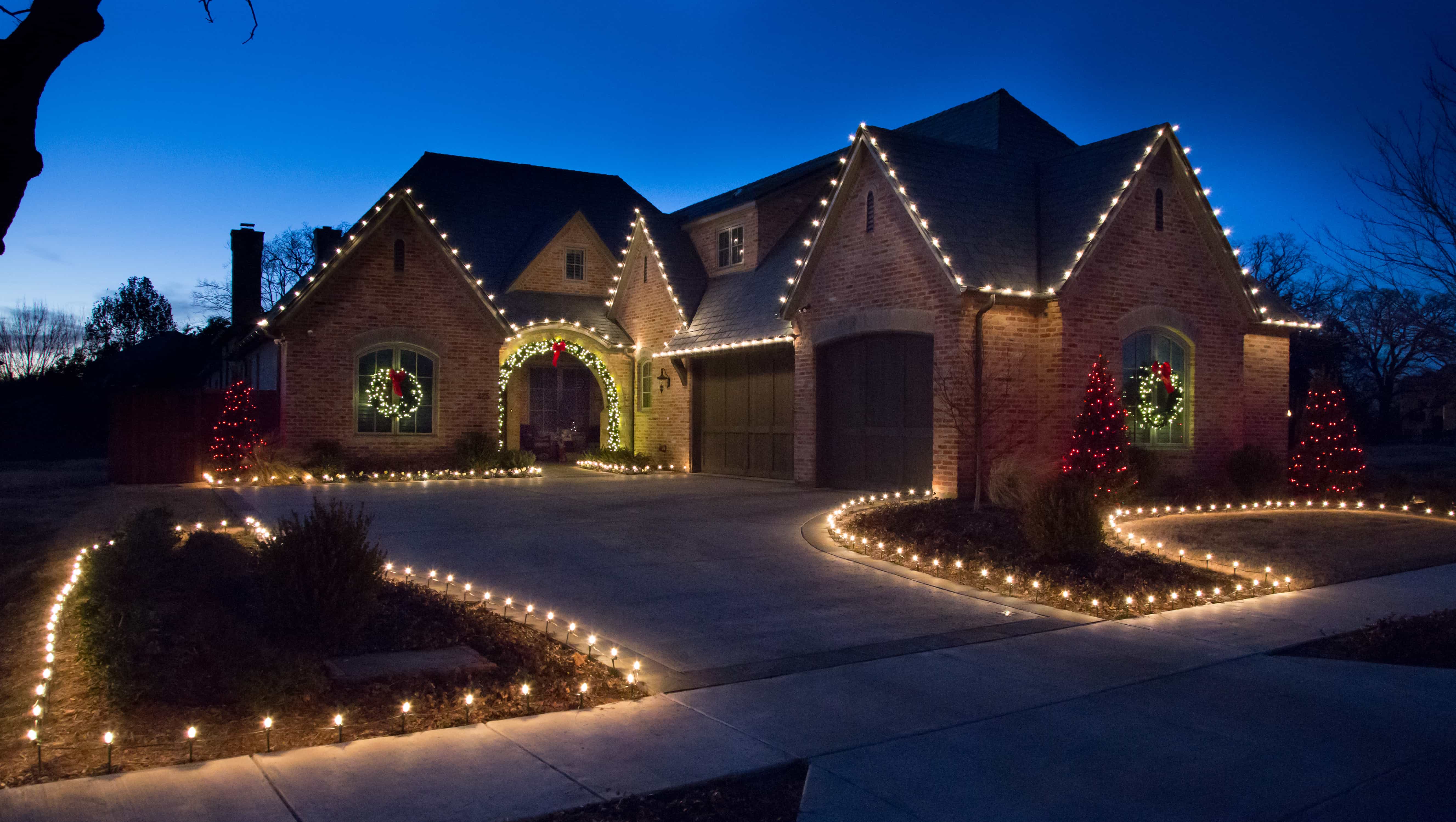 Tree wrapping xmas lights McHenry County